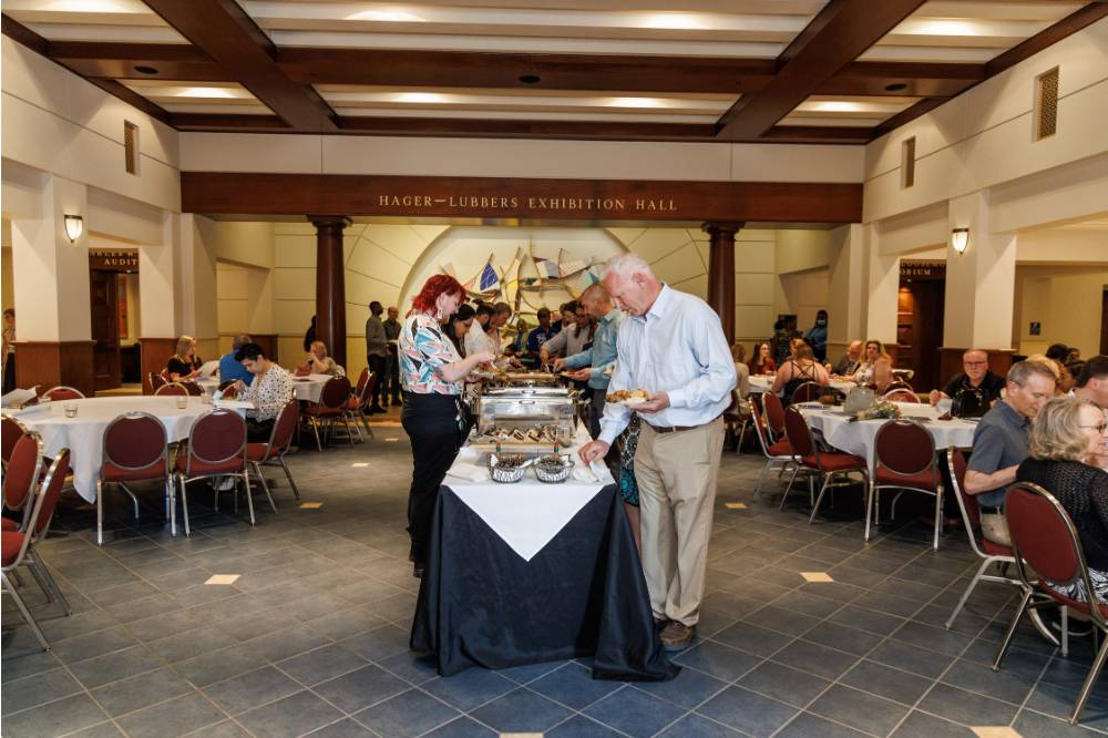 Attendees at the Winter 2023 Citation Awards grabbing food
